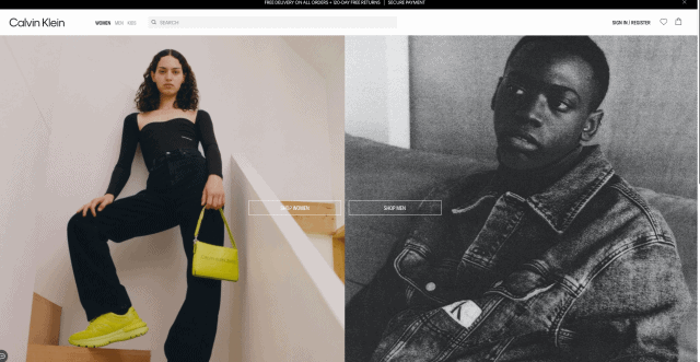 The Calvin Klein website home page. There are two side by side images of a man and a woman modelling the products. At the top of the page there is a navigation and search bar, and in the middle of the page are two buttons labelled “shop women” and “shop men”.