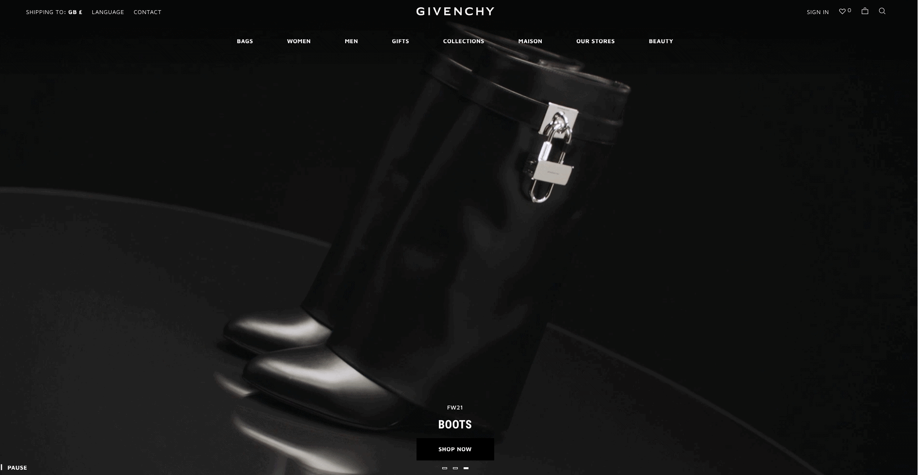 The Givenchy home page. Most of the page is taken up by white space in the form of a photograph of a pair of boots. There is a simple navigation bar at the top of the page with white text on a black background.